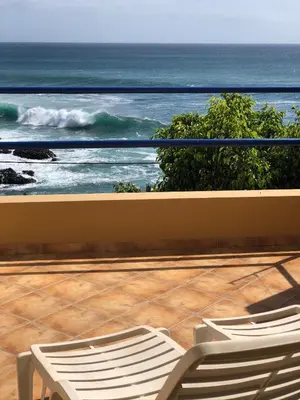 two chairs on a balcony looking at the ocean at XXL Apt w/ Surprising Gorgeous Ocean View in Praia