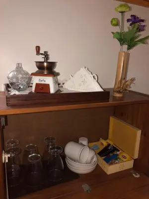 a shelf with a mixer and other items on it at Splendid Guest Suite with Separate Private Ocean View Terrace in Praia
