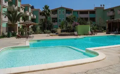 a swimming pool in front of a apartment complex at More then a beautiful apart The real Morabeza Capeverdean hospitality in Santa Maria
