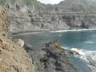 a group of people in the water at a beach at Pousada do Ceu in Paul