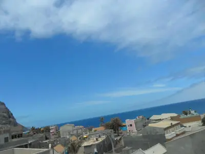 a view of a city with the ocean in the background at Casa Celeste in Ponta do Sol