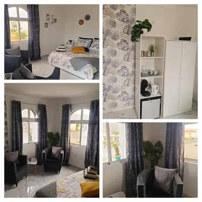a collage of four pictures of a bedroom at Deluxe B&B 