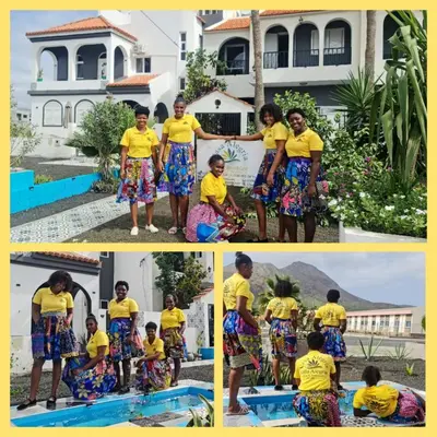 a group of children in yellow shirts standing by a swimming pool at Deluxe B&B 