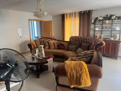 a living room with a couch and a table at YOUR HOME AWAY FROM HOME in Praia