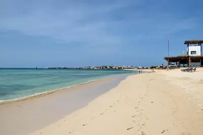 a sandy beach with the ocean in the background at Ca' Santa Barbara, Free Wi-fi, Sea view, Sal Rei, Boa Vista, Cape Verde in Sal Rei