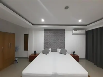 a bedroom with a large white bed in it at Apto T1 Sweet Home in Praia
