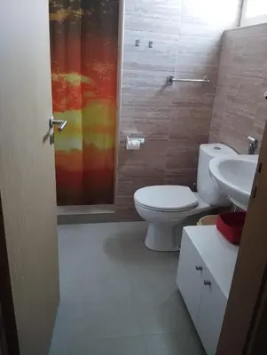 a bathroom with a toilet and a sink and a shower at LAFAYETTE Alojamentos in Espargos