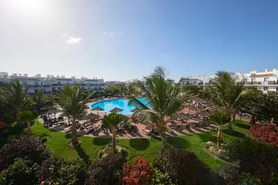 an aerial view of a resort with a pool and palm trees at Melia Dunas Beach Resort & Spa - All Inclusive in Santa Maria