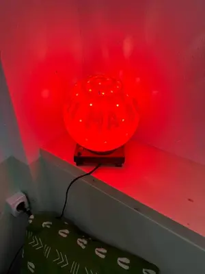 a red lamp sitting on top of a shelf at B&B Mi Ma Bo, Sal Rei, Boa Vista, Cape Verde, FREE WI-FI in Sal Rei