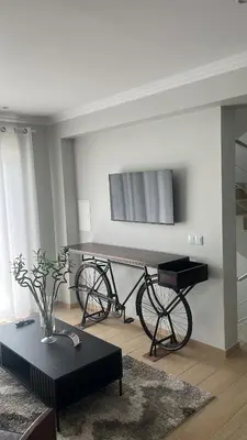 a bike in a living room with a piano at Txon DFogo Pensão Restaurante in São Filipe