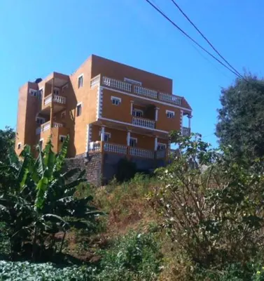 a large building on top of a hill at Residensia Ka Denxu in Vila Nova Sintra