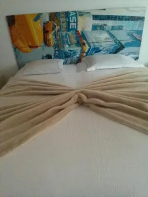 a close up of a bed in a room at Maison Residencial casa de ferias in Pedra Badejo
