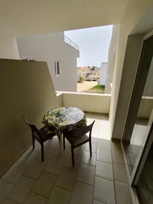 a room with two chairs and a table on a balcony at Rosa dei Venti Apartment 50meter beach front in Sal Rei