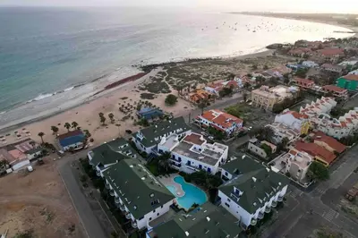 an aerial view of a resort on the beach at Leme Bedje - By Bobbywashere in Santa Maria