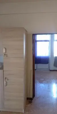 an empty room with a door and a window at Cubico Tota in Praia