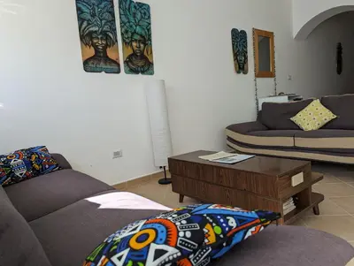 a living room with two couches and a coffee table at African Sunset in Sal Rei