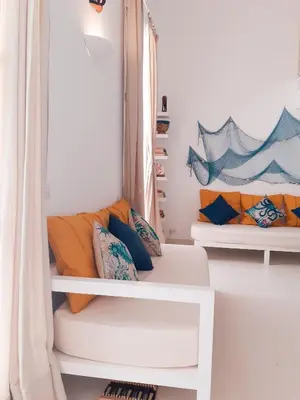 a living room with two couches in a window at App Rosanna, Estoril Beach, 2steps from the sea, Free Wi-Fi & AC in Sal Rei