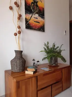 two vases sitting on top of a wooden cabinet at App Raffaele Estoril Beach Free Wifi & AC a step away from the sea in Sal Rei
