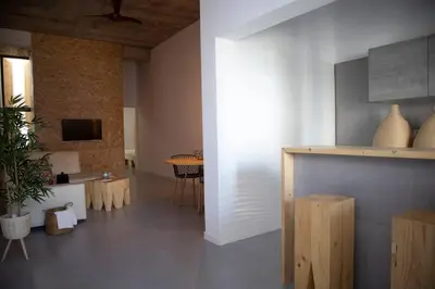 a living room with a table and a dining room at Urban Sal Loft in Espargos