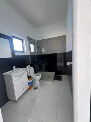 a bathroom with a toilet and a sink at Académico do Sal in Espargos