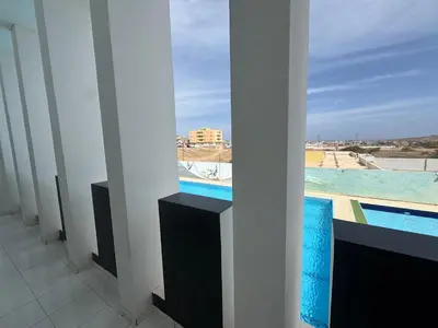 a room with a view of a pool from a building at Académico do Sal in Espargos