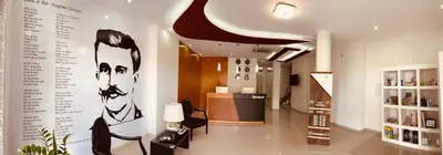 a lobby of a pharmacy with a sign on the wall at Hotel Vista in Praia