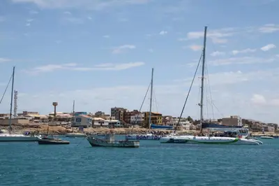 a group of boats docked in a harbor at Villa Pescadora spectacular view, luxery fisherhouse design in Sal Rei
