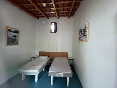 a hospital room with two beds in it at Quintal do Maio in Vila do Maio