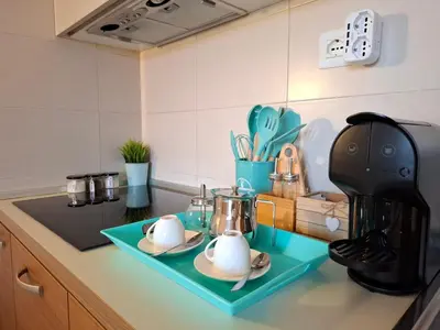 a kitchen counter with two teapots and a coffee maker at Sunset house Cabo Verde in Santa Maria