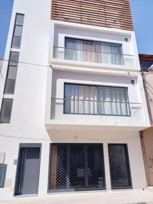 a white building with a balcony at Duarte Apartments - Lux in Mindelo
