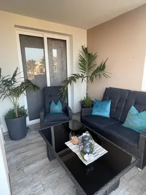 a living room with a couch and a table at Luxury Beachhouse Apartment Boa Vista in Sal Rei