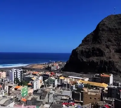 a view of a city with a mountain in the background at LA MENOR in Ribeira Grande