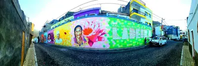 a building with a mural on the side of it at LA MENOR in Ribeira Grande