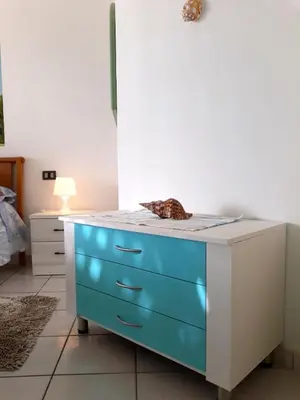 a dresser with blue draws in a room at Beach house Agua Viva, Praia de Chaves, Boa Vista, Sal Rei, Cape Vert, 50mt spiaggia in Cabeçadas
