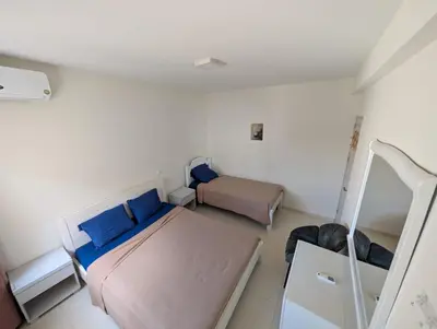 a small bedroom with two beds and a mirror at Casa Relaxod in Santa Maria