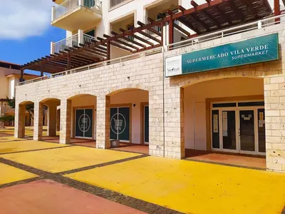 a building with a sign on the side of it at Apartamento Privado Vila Verde in Santa Maria