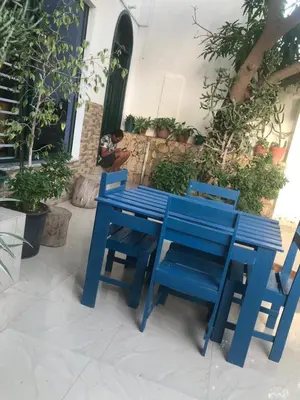 a blue table and chairs sitting on a patio at Apartamento T1 Moderno com Wi-Fi in Praia
