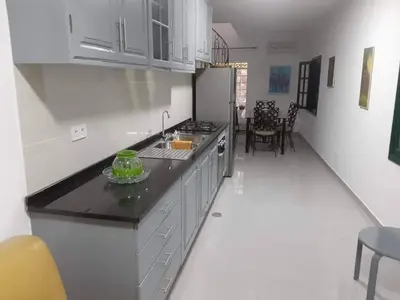 a kitchen with a sink and a counter top at Apartamento T1 Moderno com Wi-Fi in Praia