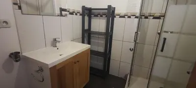 a bathroom with a sink and a shower at casa verde lucas in Mindelo
