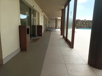 a hallway of a building with a tile floor at Seafront Holiday House on the Mindelo Bay in Mindelo