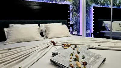 a bedroom with a bed with a blanket and a tray on it at Appartement Cara do Mar in Praia