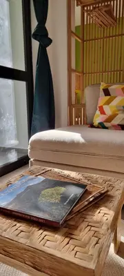 a wooden coffee table with a book on top of it at Kasa d'Vizin in Paul