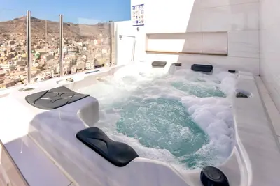 a jacuzzi tub in a building with snow at Penthouse with jacuzzi and sea view, Morabeza Deluxe in Mindelo