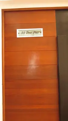 a wooden garage door with a sign on it at Ocean Roof in Santa Maria