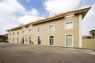 a large building with a lot of windows at Oasis Tarrafal Alfandega Suites in Tarrafal