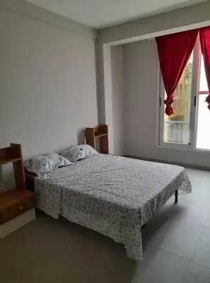 a bedroom with a bed and a window at Apartamento T2 em Sal Rei - Boavista in Sal Rei