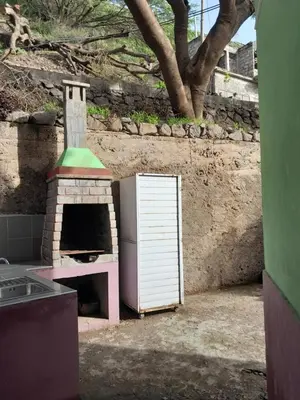 a kitchen with a stove and a oven at Pousada Rural Simpatia in Caculi
