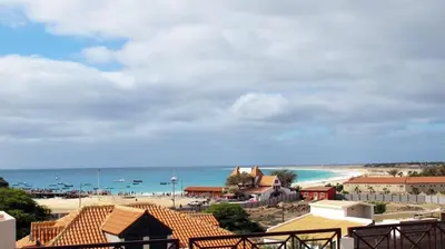 a view of a beach and the ocean at Time Out Pátio Antigo AC Wifi in Santa Maria