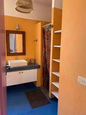 a bathroom with a sink and a mirror at BookingBoavista - Apartments in Sal Rei