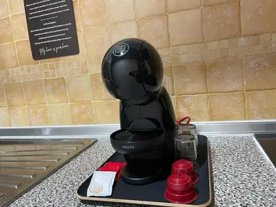 a black blender sitting on a tray on a counter at Cacau's Home - By Albis Harena in Santa Maria